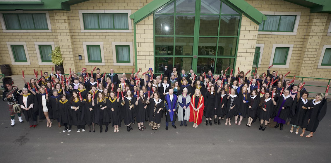 Group photo of graduates and students