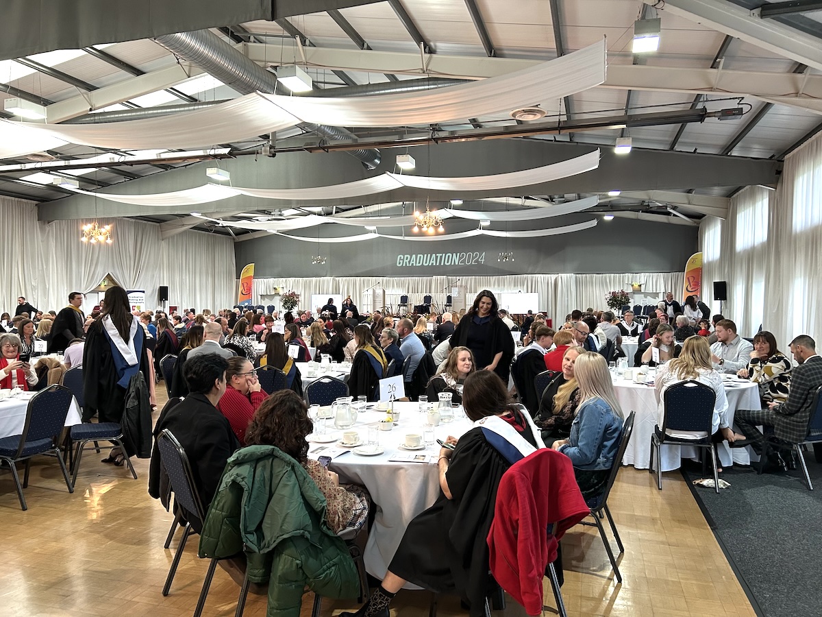 Photo showing attendees at a graduation ceremony